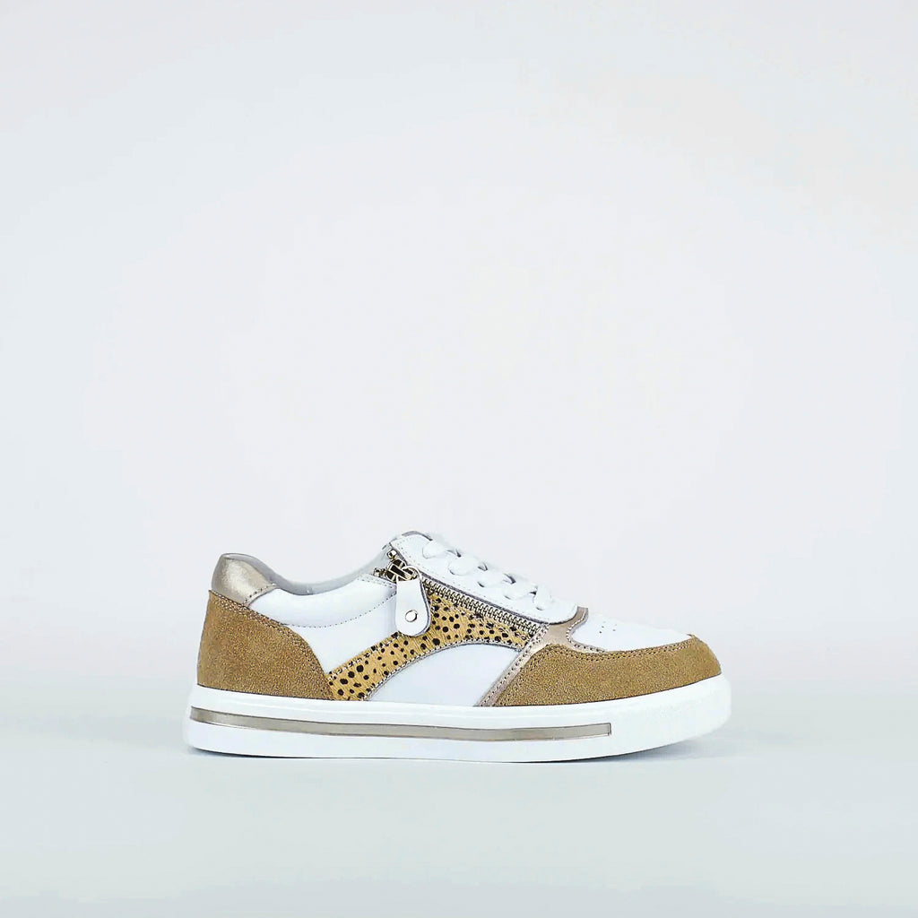 White sneaker with beige accents on a light gray background