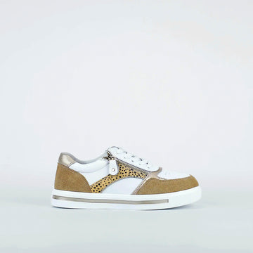 White sneaker with beige accents on a light gray background
